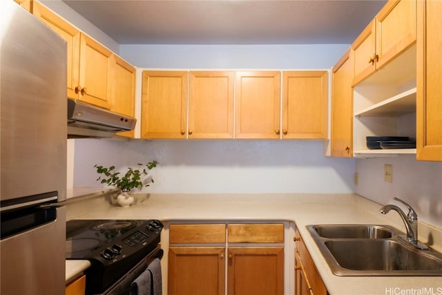 kitchen with stainless steel fridge, light brown cabinets, black / electric stove, and sink