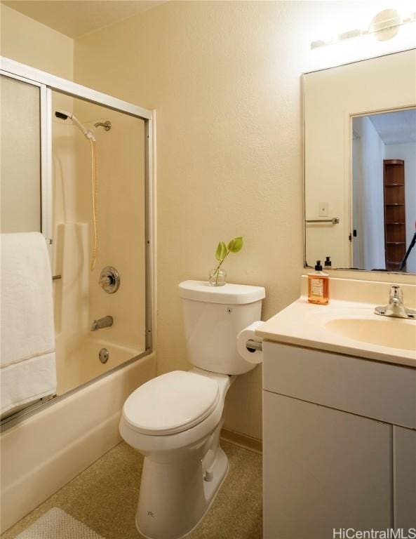 full bathroom with vanity, toilet, and bath / shower combo with glass door