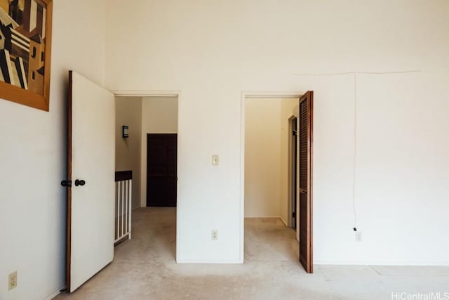 unfurnished bedroom with light carpet