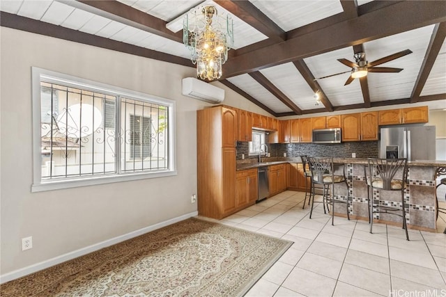 kitchen featuring a wall unit AC, lofted ceiling with beams, a breakfast bar area, stainless steel appliances, and light tile patterned floors