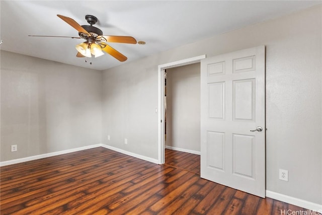 unfurnished bedroom with ceiling fan and dark hardwood / wood-style flooring