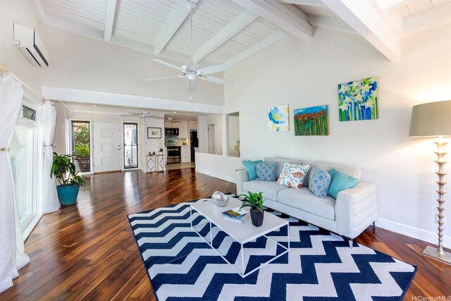 living room with ceiling fan, an AC wall unit, and wood finished floors