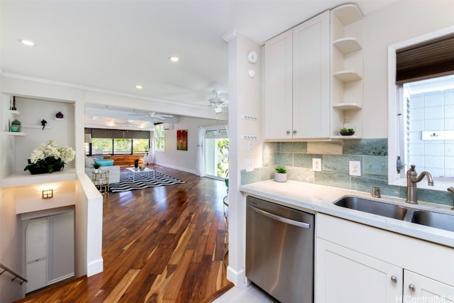 kitchen with decorative backsplash, white cabinetry, dishwasher, dark hardwood / wood-style floors, and sink