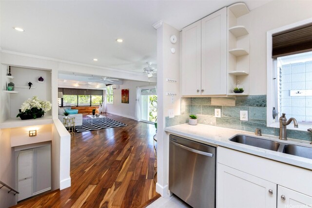 kitchen with wood finished floors, open shelves, a sink, and dishwasher