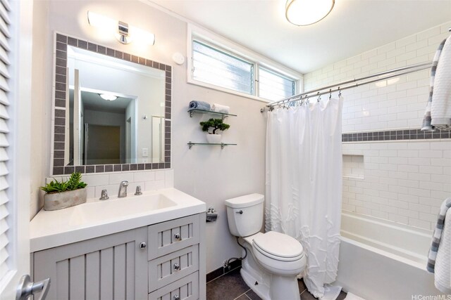 bathroom featuring tile patterned flooring, vanity, toilet, shower / bath combination with curtain, and tasteful backsplash