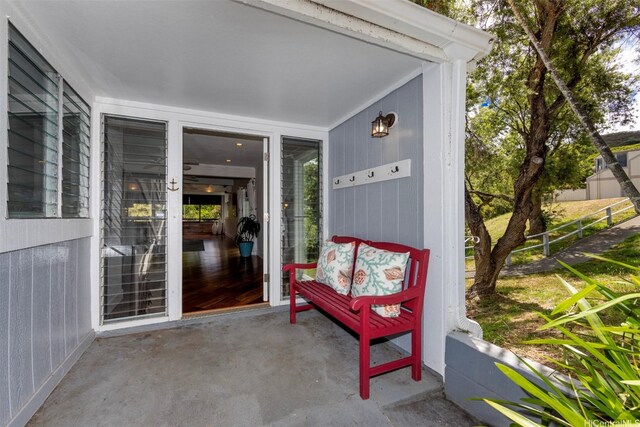 doorway to property featuring fence
