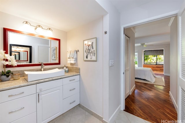 bathroom featuring vanity, wood-type flooring, and ceiling fan