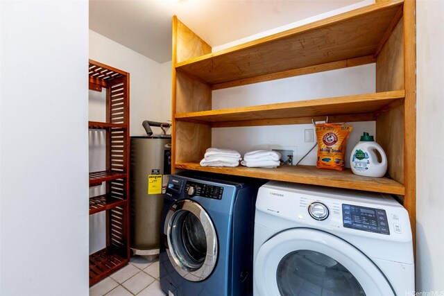 laundry area featuring laundry area, water heater, independent washer and dryer, and light tile patterned floors