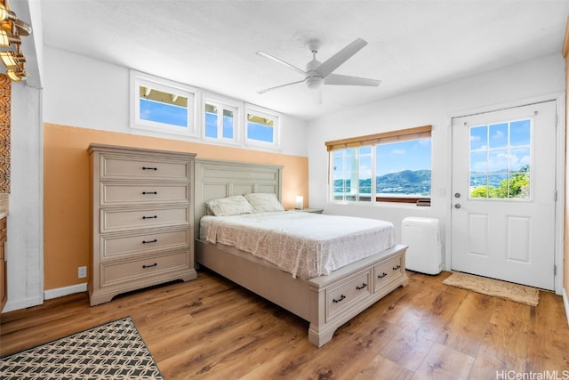 bedroom featuring ceiling fan and light wood-type flooring