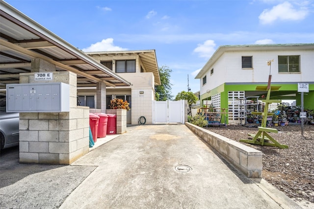 708E Olokele Ave, Honolulu, HI 96816 - view of side of property featuring mail area and a gate