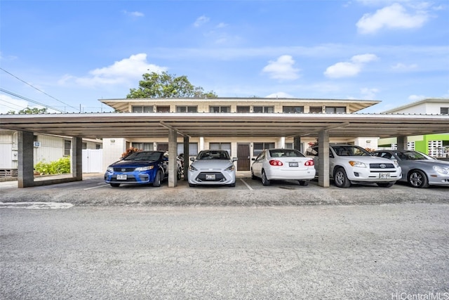 view of vehicle parking featuring a carport