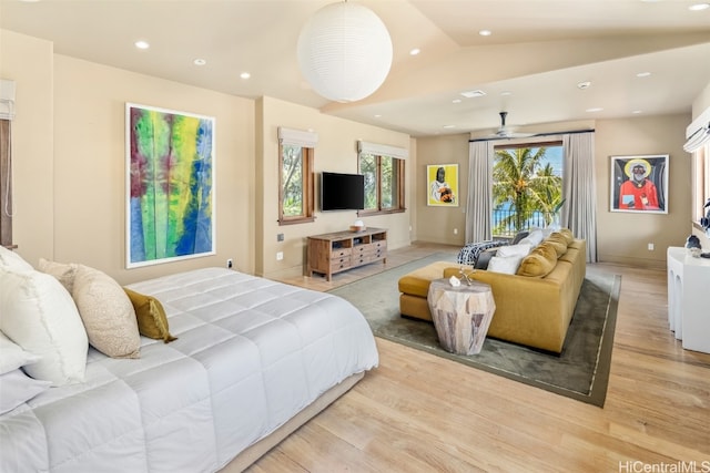 bedroom with light hardwood / wood-style flooring, access to exterior, and lofted ceiling