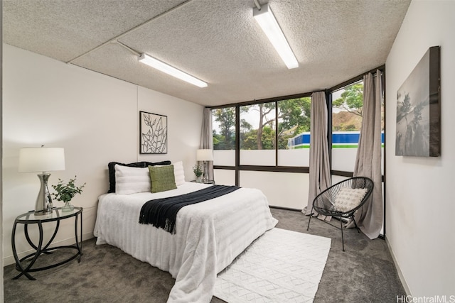 carpeted bedroom with a textured ceiling