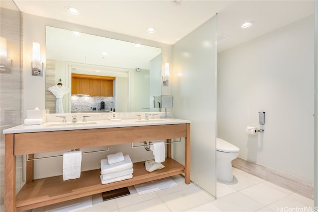 bathroom with vanity, toilet, tasteful backsplash, and tile patterned flooring