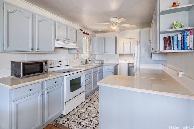 kitchen with washer / clothes dryer, sink, a textured ceiling, white appliances, and ceiling fan