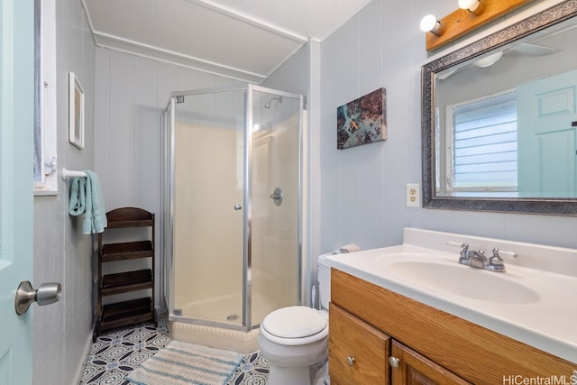 bathroom with a shower with door, toilet, tile patterned flooring, vanity, and wood walls