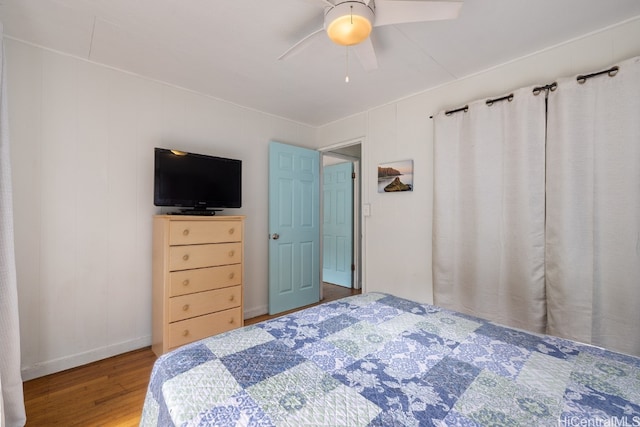 bedroom with wood-type flooring and ceiling fan