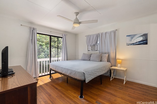 bedroom featuring cooling unit, hardwood / wood-style flooring, and ceiling fan