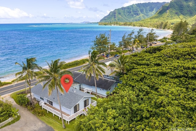 drone / aerial view featuring a water view and a beach view