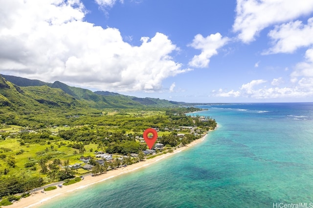 aerial view with a water and mountain view and a beach view