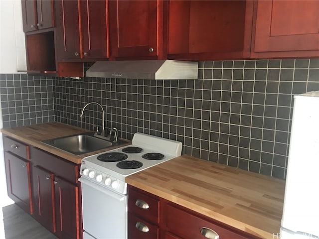 kitchen with wood-type flooring, sink, wood counters, white electric range, and decorative backsplash