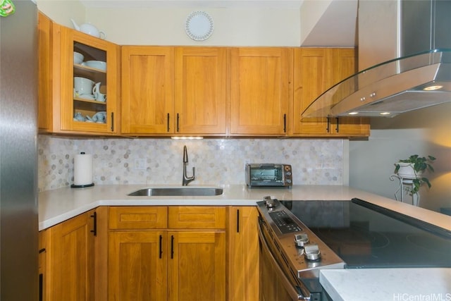 kitchen with stainless steel appliances, sink, decorative backsplash, and exhaust hood