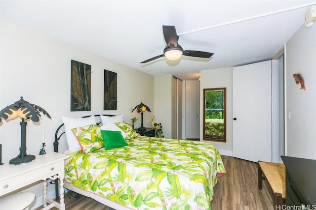 bedroom featuring ceiling fan and dark hardwood / wood-style flooring