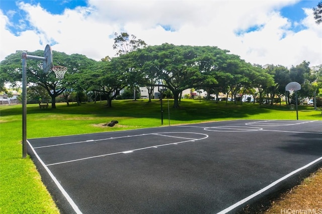 view of basketball court featuring a lawn