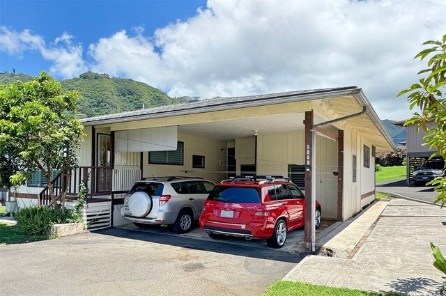 3360 E Manoa Rd Unit C, Honolulu, HI 96822 - view of parking with a carport and asphalt driveway