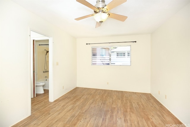 spare room with light hardwood / wood-style floors and ceiling fan