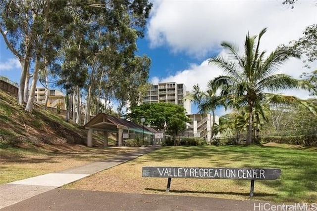 view of home's community with a lawn