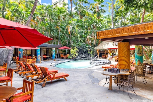 view of swimming pool featuring a gazebo and a patio