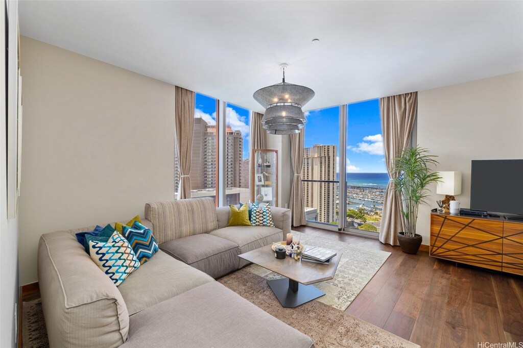 1555 Kapiolani Blvd Unit 2208, Honolulu, HI 96814 - living room featuring wood-type flooring and floor to ceiling windows