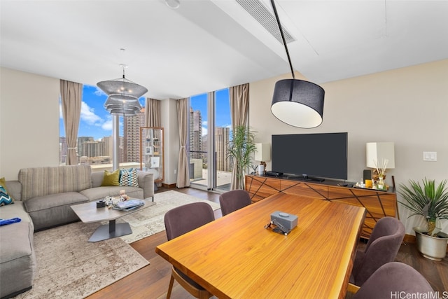 living room featuring hardwood / wood-style floors and floor to ceiling windows