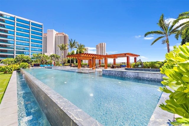 view of swimming pool with a pergola