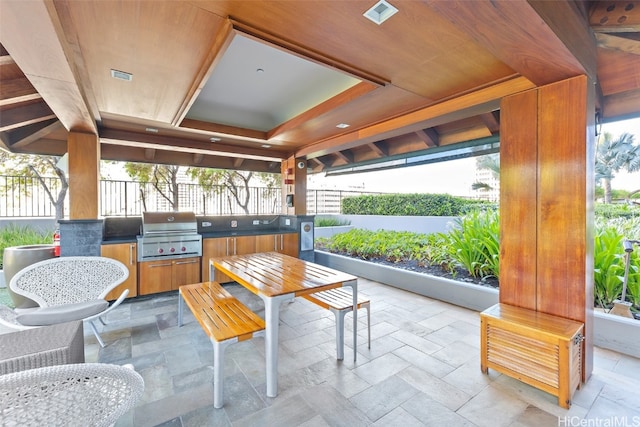 sunroom / solarium with a tray ceiling