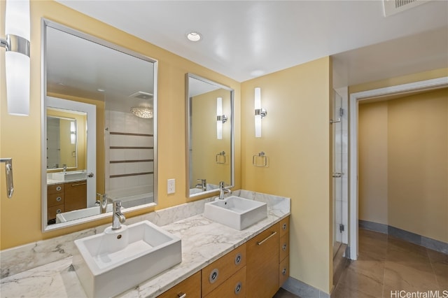 bathroom with vanity and tile patterned flooring