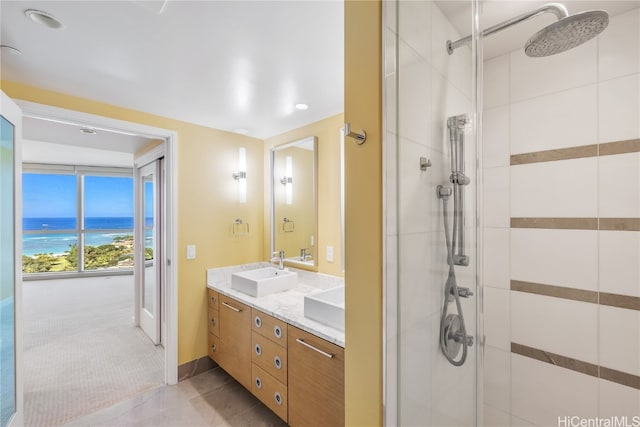 bathroom featuring vanity, tile patterned flooring, and an enclosed shower