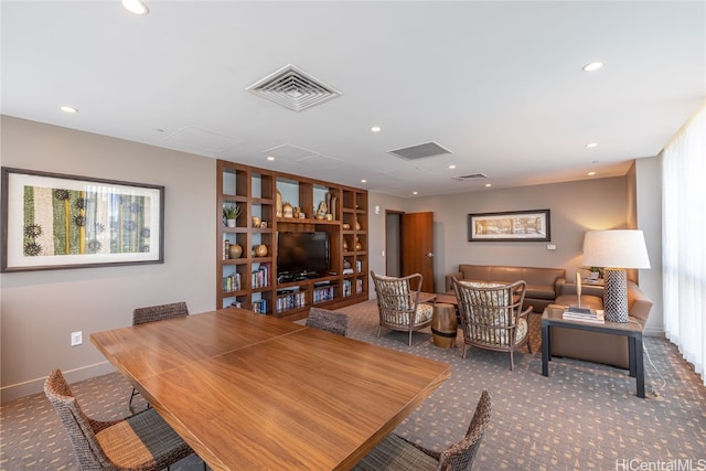 dining area featuring carpet flooring