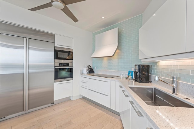 223 Saratoga Rd Unit 3801 Penthouse A, Honolulu, HI 96815 - kitchen with built in appliances, modern cabinets, a sink, white cabinetry, and light stone counters