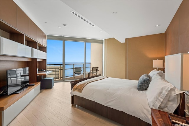 223 Saratoga Rd Unit 3801 Penthouse A, Honolulu, HI 96815 - bedroom featuring a wall of windows, light wood-style floors, and access to exterior