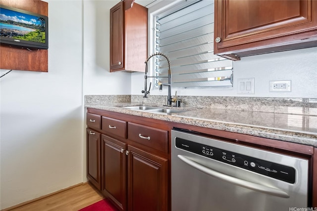 98-707 Iho Pl Unit 2-1404, Aiea, HI 96701 - kitchen with dishwasher, a sink, light wood-style flooring, and light stone countertops