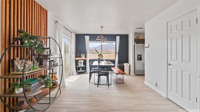 dining room with light hardwood / wood-style flooring