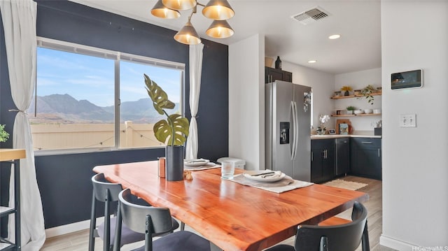 87-1950 Pakeke St Unit F, Waianae, HI 96792 - dining area featuring a mountain view, light wood-type flooring, and recessed lighting