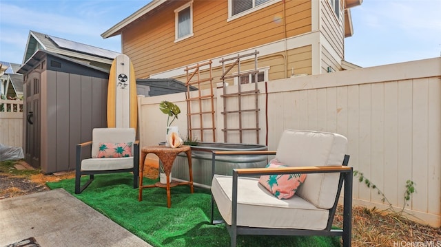 view of patio / terrace with a shed