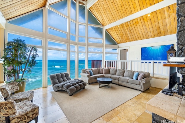 living room featuring beam ceiling, light tile patterned floors, high vaulted ceiling, wooden ceiling, and a water view