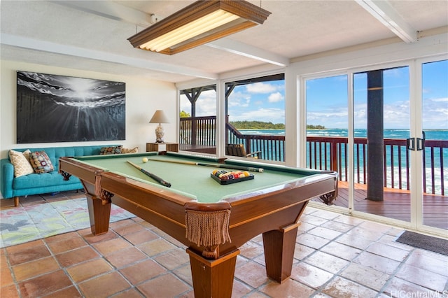 playroom with beamed ceiling, a water view, and billiards