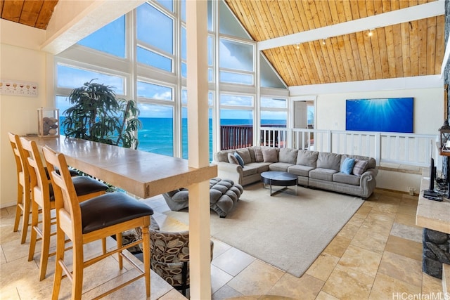 interior space featuring beamed ceiling, high vaulted ceiling, and wooden ceiling