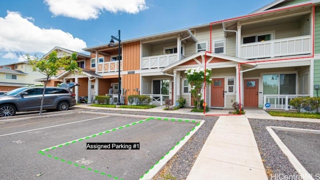 view of front of property with a balcony