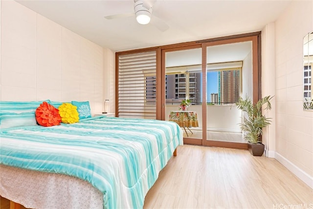 bedroom with light hardwood / wood-style flooring and ceiling fan